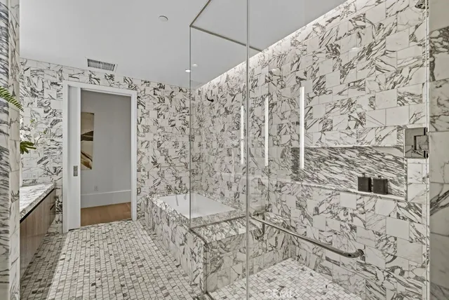 a view of a livingroom with furniture and staircase