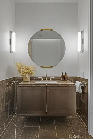 a bathroom with a sink and mirror