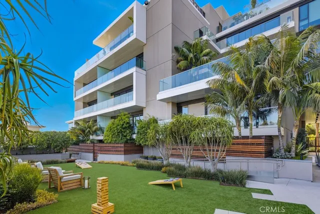 a view of a building with a yard