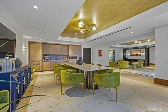 a large bedroom with a large bed and a dresser