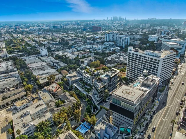a view of a patio with couches and swimming pool