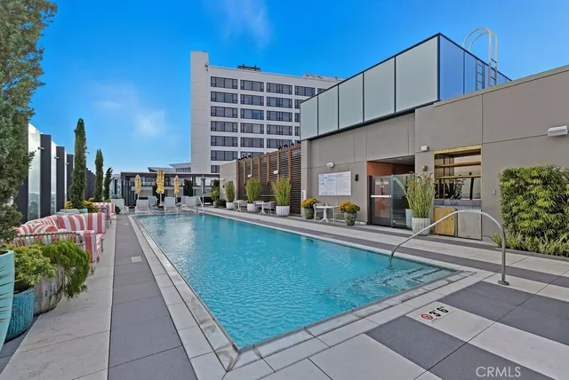 a view of a patio with swimming pool table and chairs