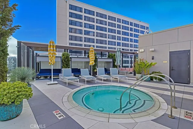 a balcony with table and chairs