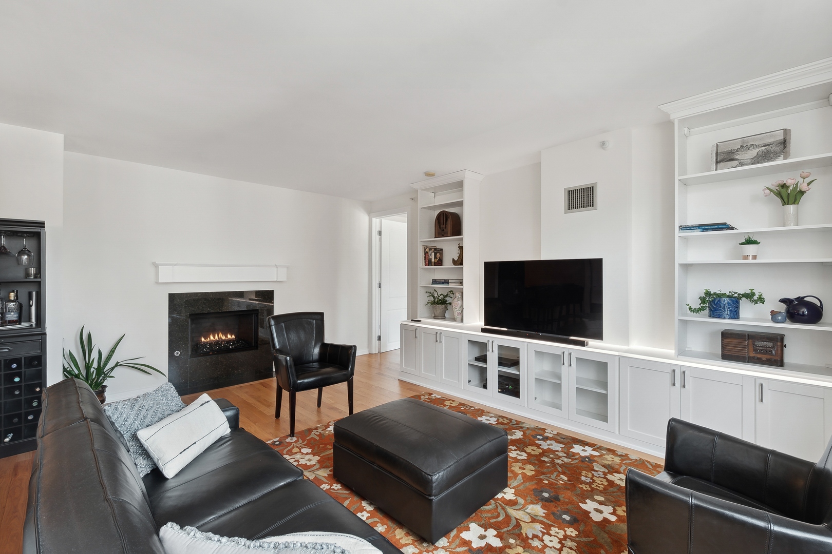 21 West Chestnut Street, Unit 1408 Chicago, IL 60610 - Photo 5 of 17 a living room with furniture and a flat screen tv