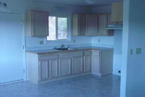 4635 A Menehune Road Waimea, HI 96796 - Photo 7 of 11 a kitchen with a sink and cabinets