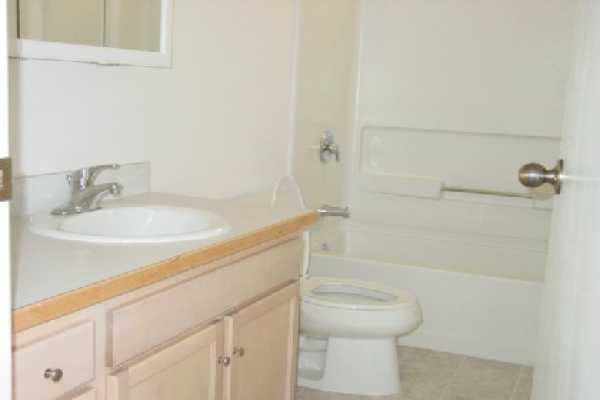 4635 A Menehune Road Waimea, HI 96796 - Photo 9 of 11 a bathroom with a granite countertop sink toilet and shower