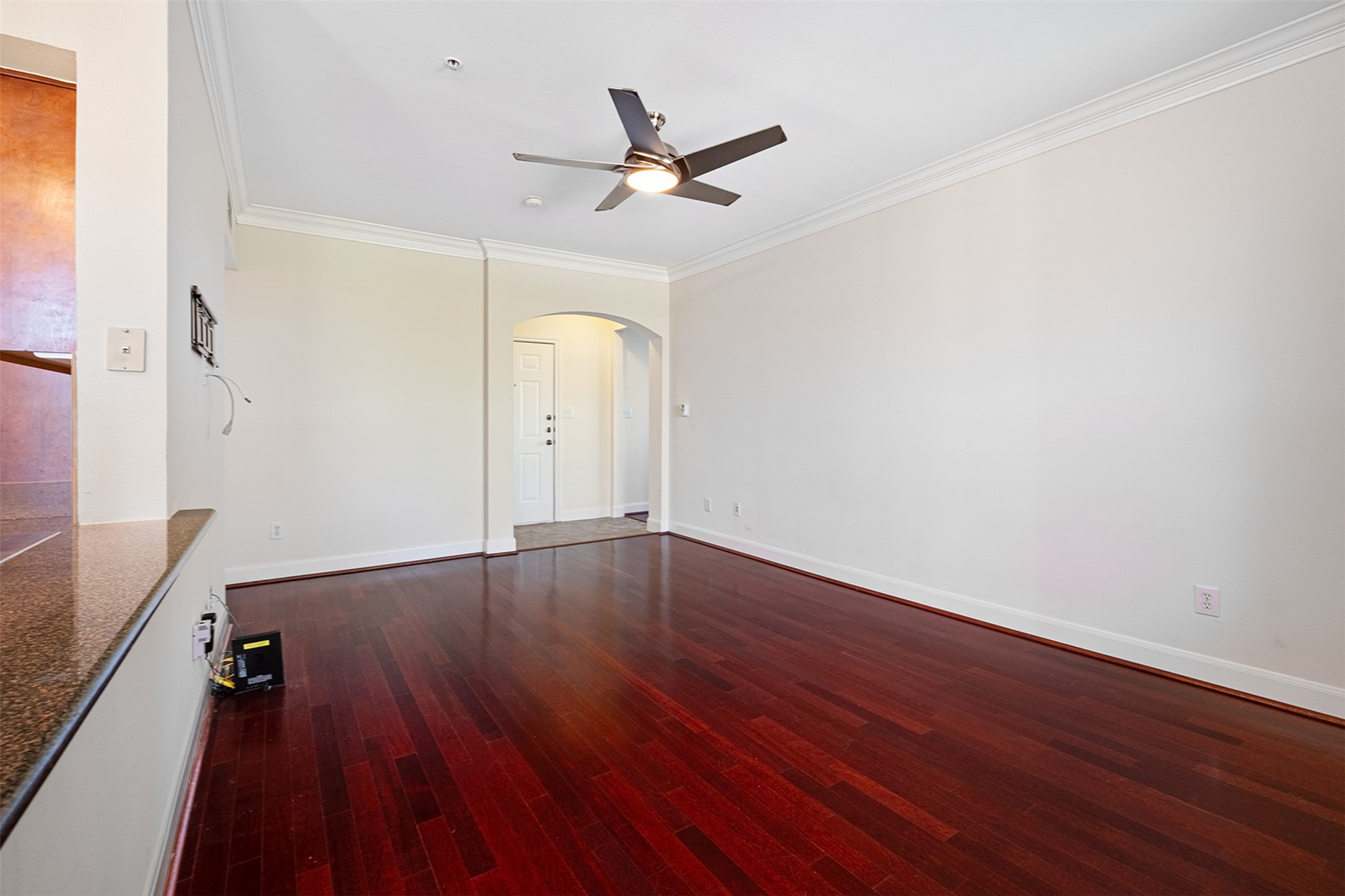 7701 Rialto Boulevard, Unit 637 Austin, TX 78735 - Photo 10 of 25 Rich hardwood floors complement elegant crown molding in this inviting living space.