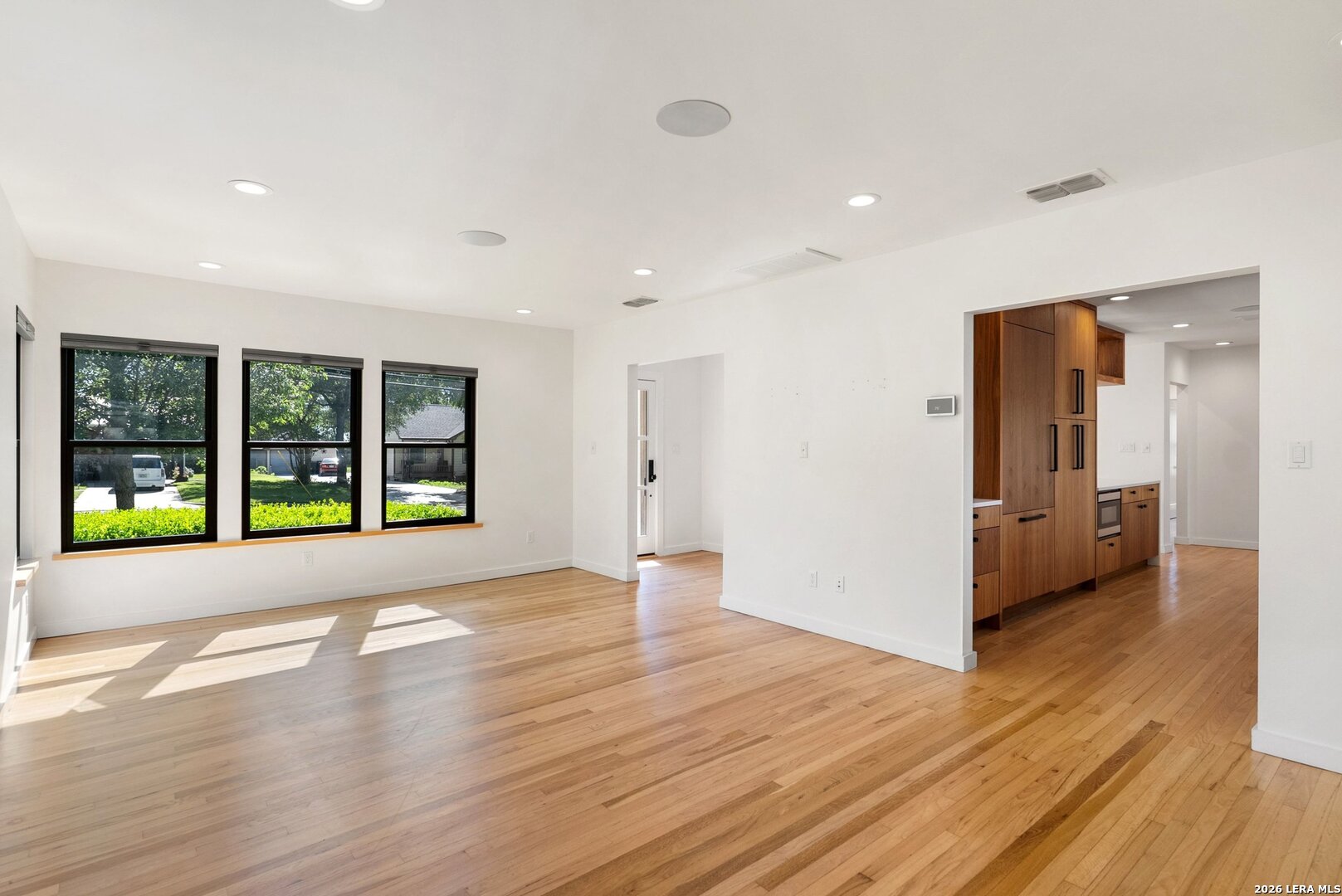 1402 Hutto Road Georgetown, TX 78626 - Photo 9 of 34 a view of empty room with wooden floor and fan
