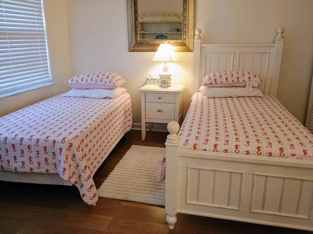 a bedroom with a bed and a dresser in it