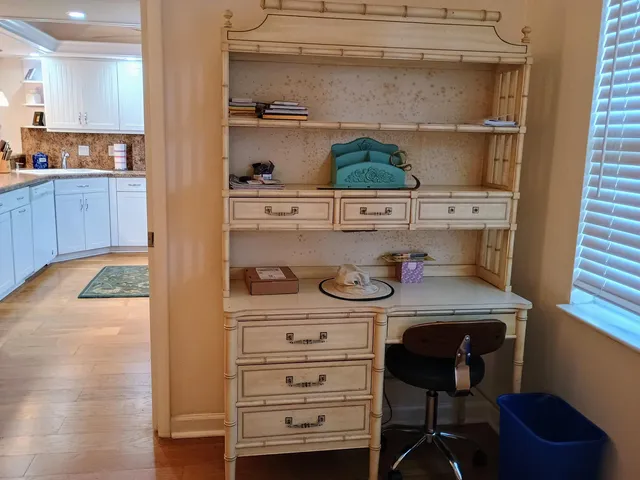 a kitchen with a refrigerator and cabinets