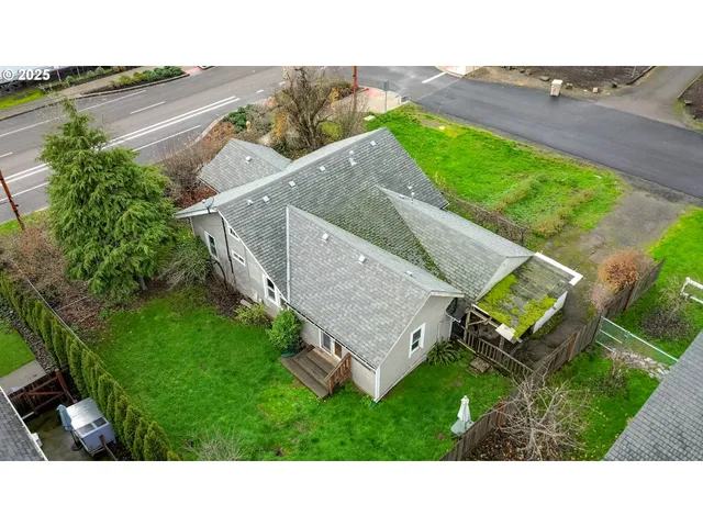 a aerial view of a house with a yard