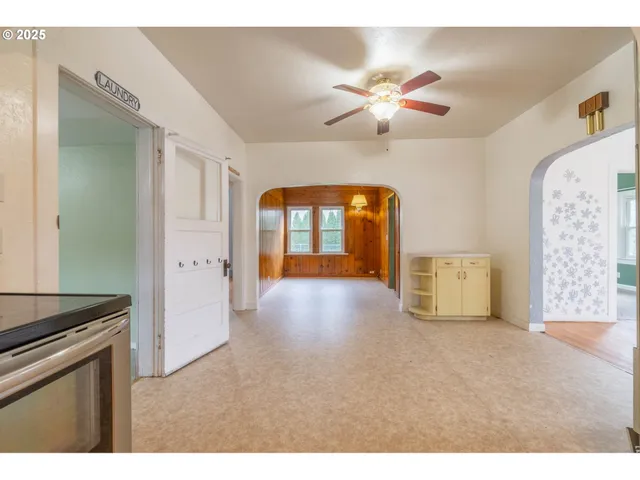a view of livingroom with an entryway and a fireplace