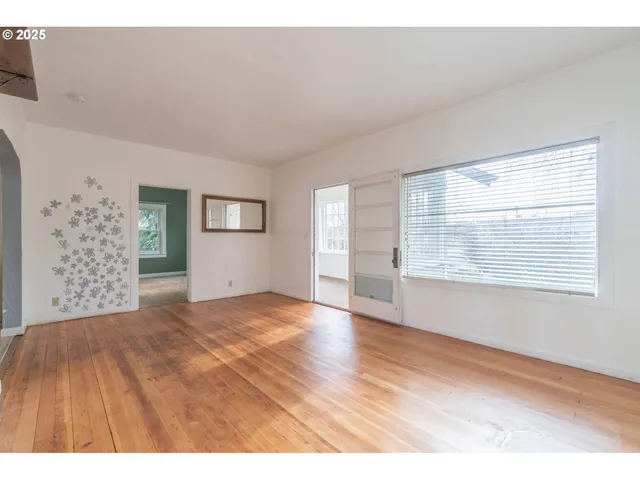 a view of an empty room with a window