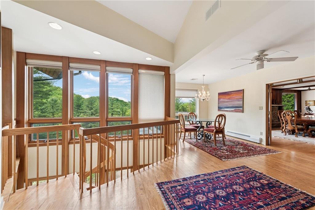 428 Jefferson School Road Ligonier, PA 15658 - Photo 12 of 50 a living room with furniture floor to ceiling window and wooden floor