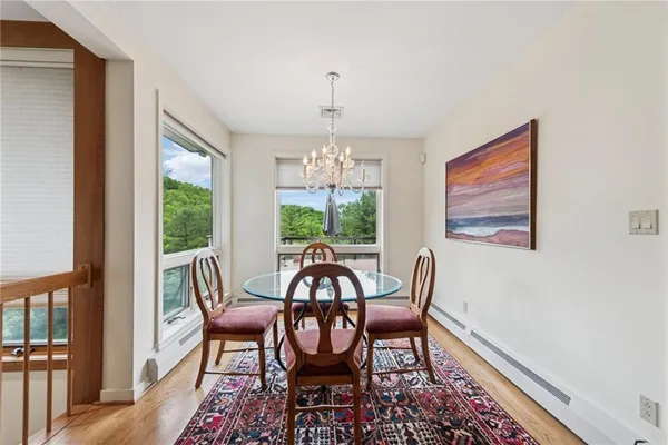 a view of a dining room with furniture window and outside view