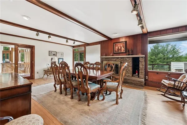a view of a dining room with furniture window and outside view