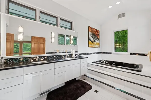a kitchen with stainless steel appliances a sink and cabinets