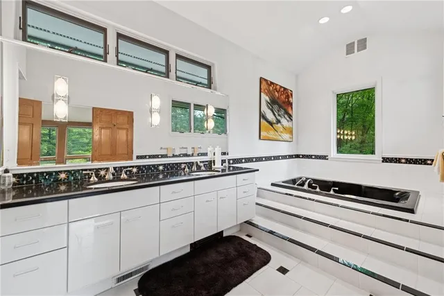 a kitchen with stainless steel appliances a sink and cabinets