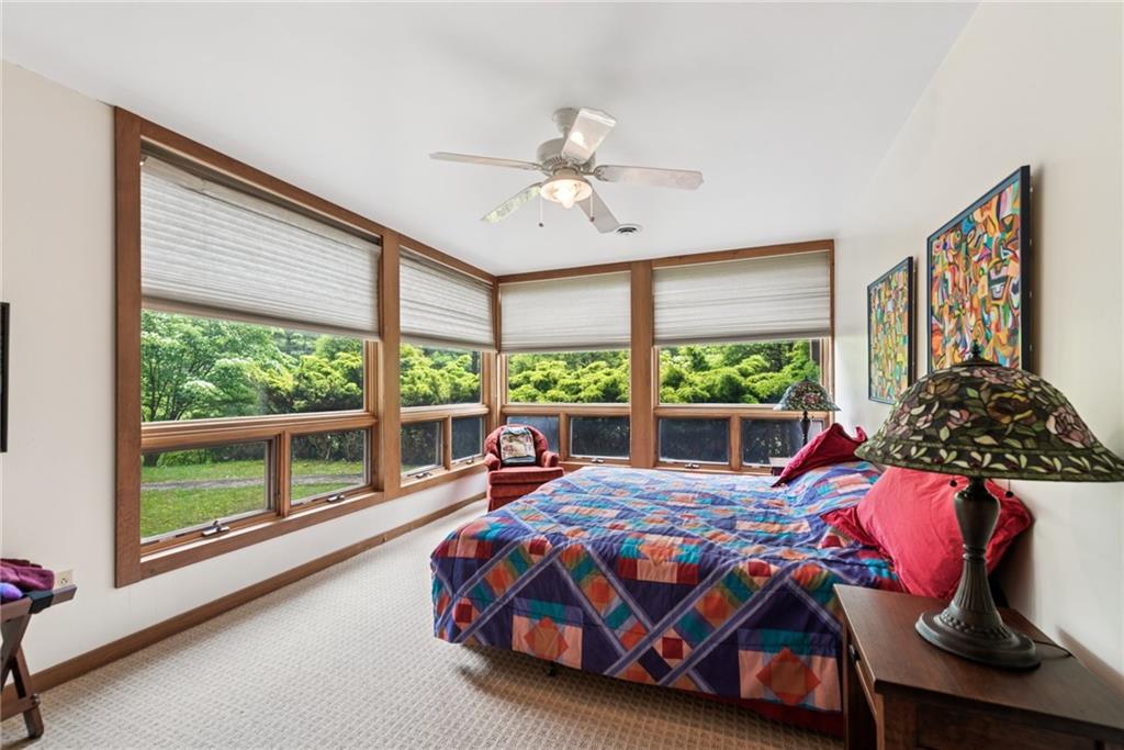 428 Jefferson School Road Ligonier, PA 15658 - Photo 30 of 50 a bedroom with a bed and a large window with the outer view