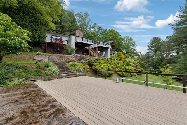 a view of a bench in front of house
