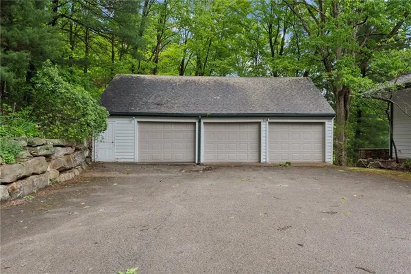 a house that has a tree in front of it