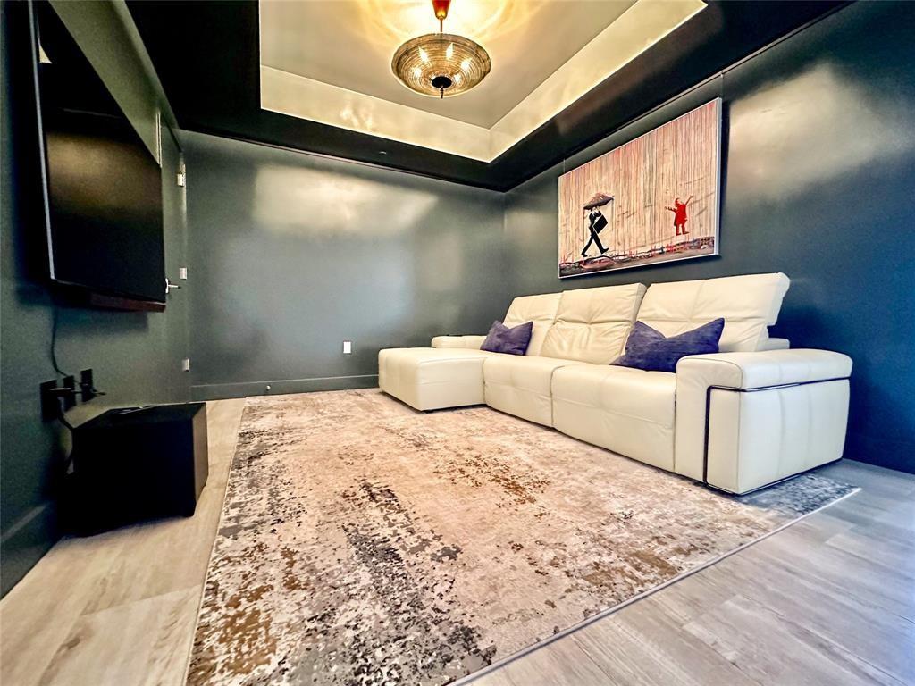 2101 South Surf Road, Unit 2C Hollywood, FL 33019 - Photo 13 of 21 a living room with furniture and a flat screen tv