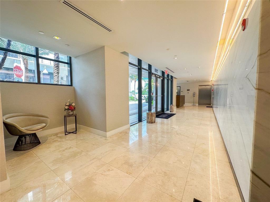 2101 South Surf Road, Unit 2C Hollywood, FL 33019 - Photo 19 of 21 a view of a hallway with wooden floor and dining room