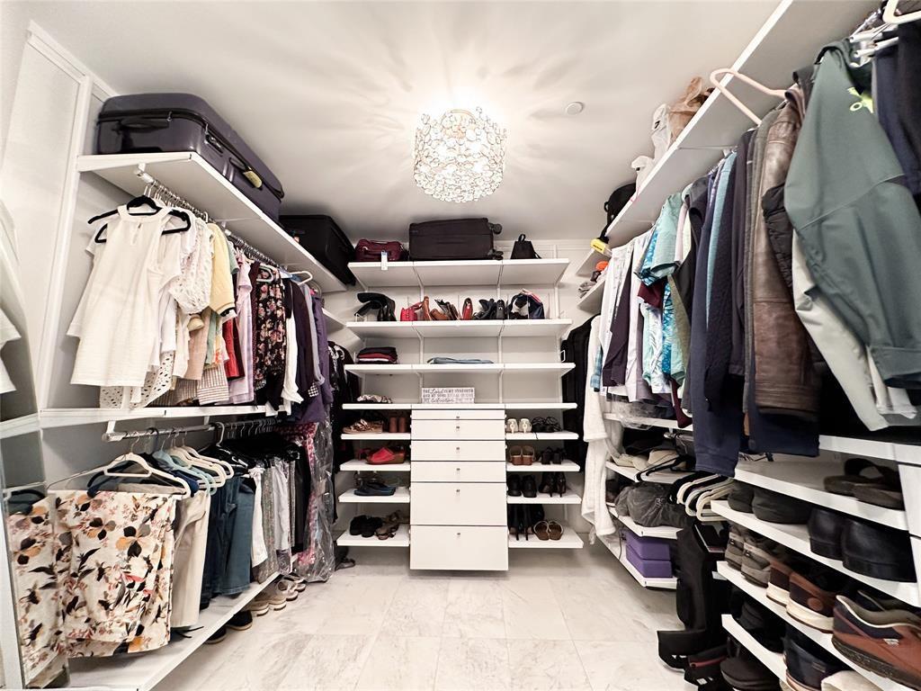 2101 South Surf Road, Unit 2C Hollywood, FL 33019 - Photo 7 of 21 a view of walk in closet with clothes and shoes