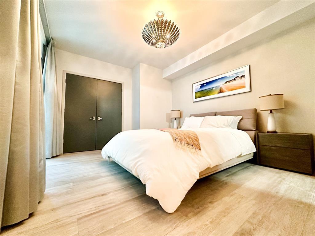 2101 South Surf Road, Unit 2C Hollywood, FL 33019 - Photo 8 of 21 a bedroom with a bed and a painting on the wall