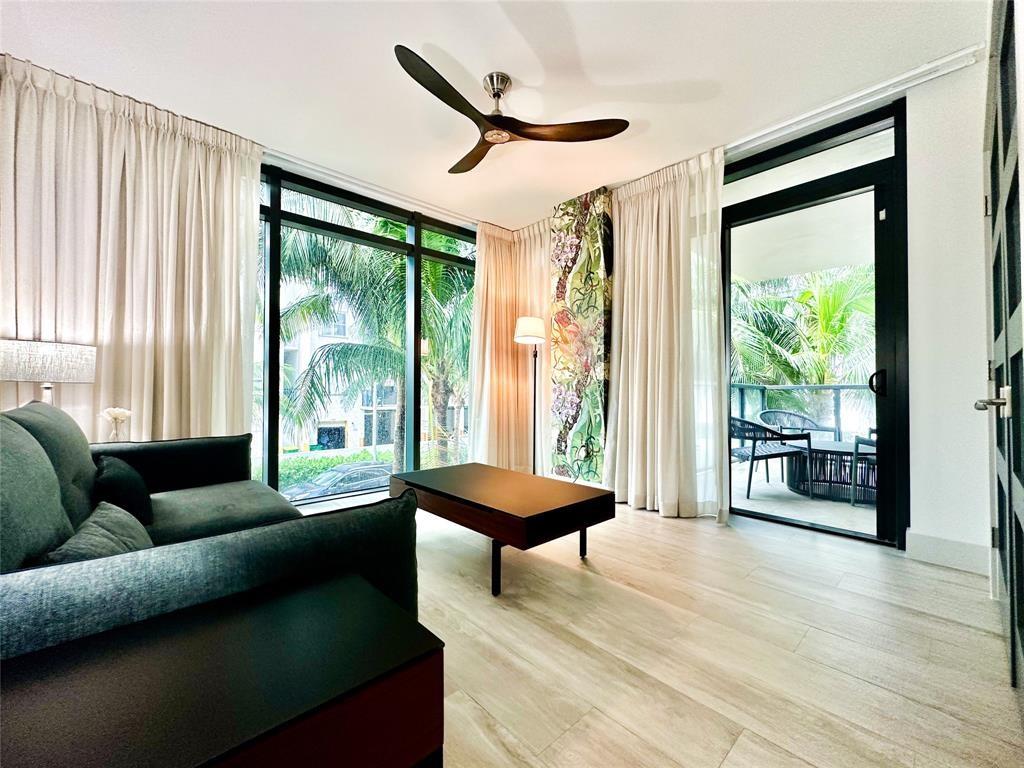 2101 South Surf Road, Unit 2C Hollywood, FL 33019 - Photo 10 of 21 a living room with furniture and a large window