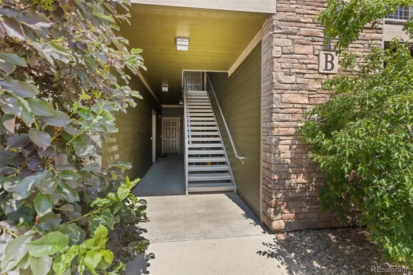 a swimming pool with outdoor seating and yard
