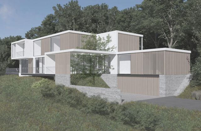 a side view of a house with a yard