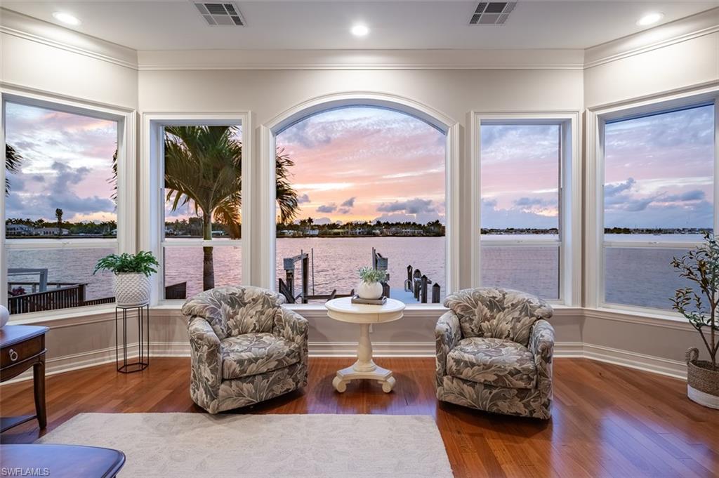 1942 Kingfish Road Naples, FL 34102 - Photo 7 of 43 a living room with furniture and a large window