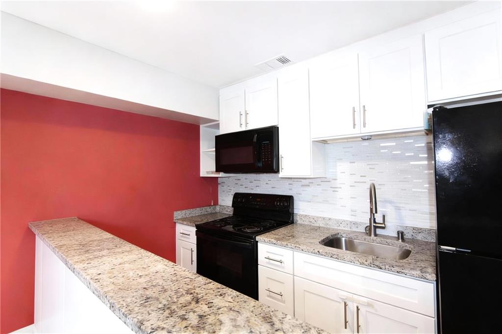500 Piedmont Road Marietta, GA 30066 - Photo 25 of 40 a kitchen with a sink and a microwave