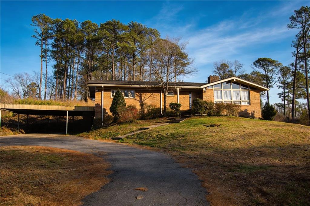 500 Piedmont Road Marietta, GA 30066 - Photo 4 of 40 a front view of a house with a yard
