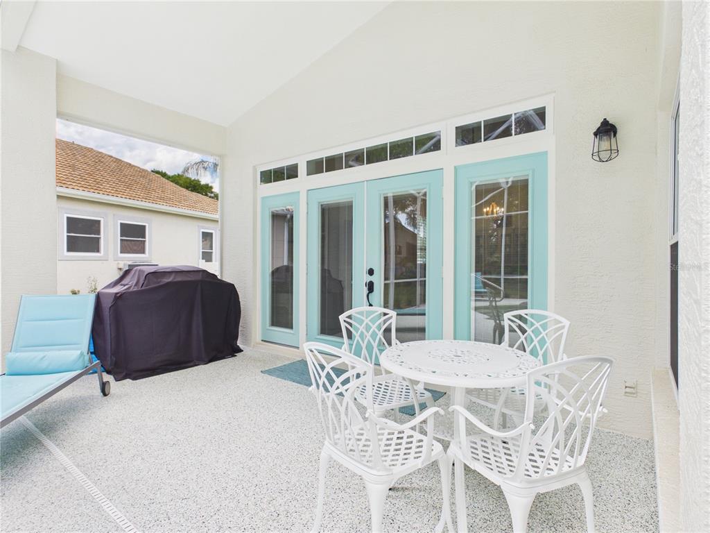 426 Long Cove Road Ormond Beach, FL 32174 - Photo 29 of 73 a view of a dining room with furniture and wooden floor