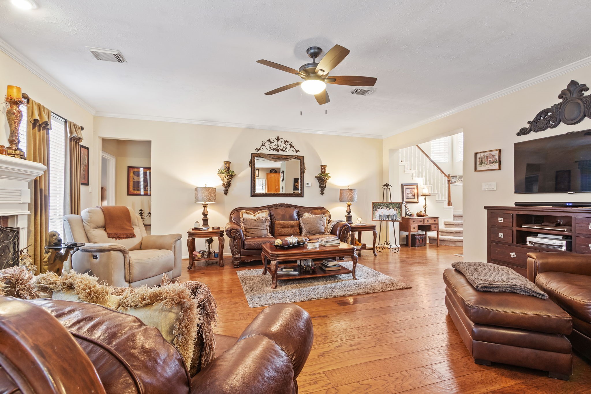 3618 Walnut Forest Lane Spring, TX 77388 - Photo 12 of 41 a living room with furniture a fireplace and a flat screen tv