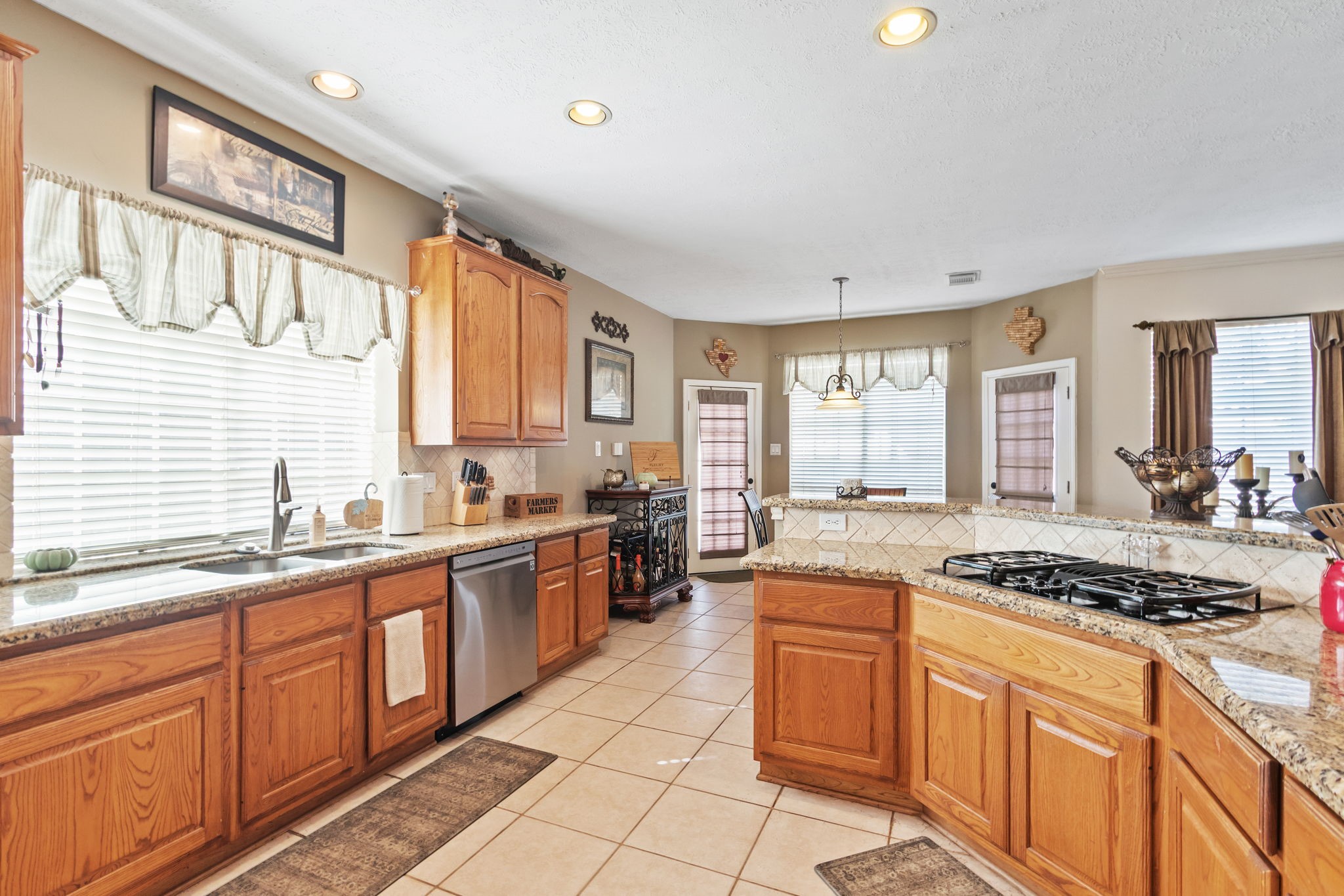 3618 Walnut Forest Lane Spring, TX 77388 - Photo 16 of 41 a kitchen with stainless steel appliances granite countertop a stove a sink and a refrigerator