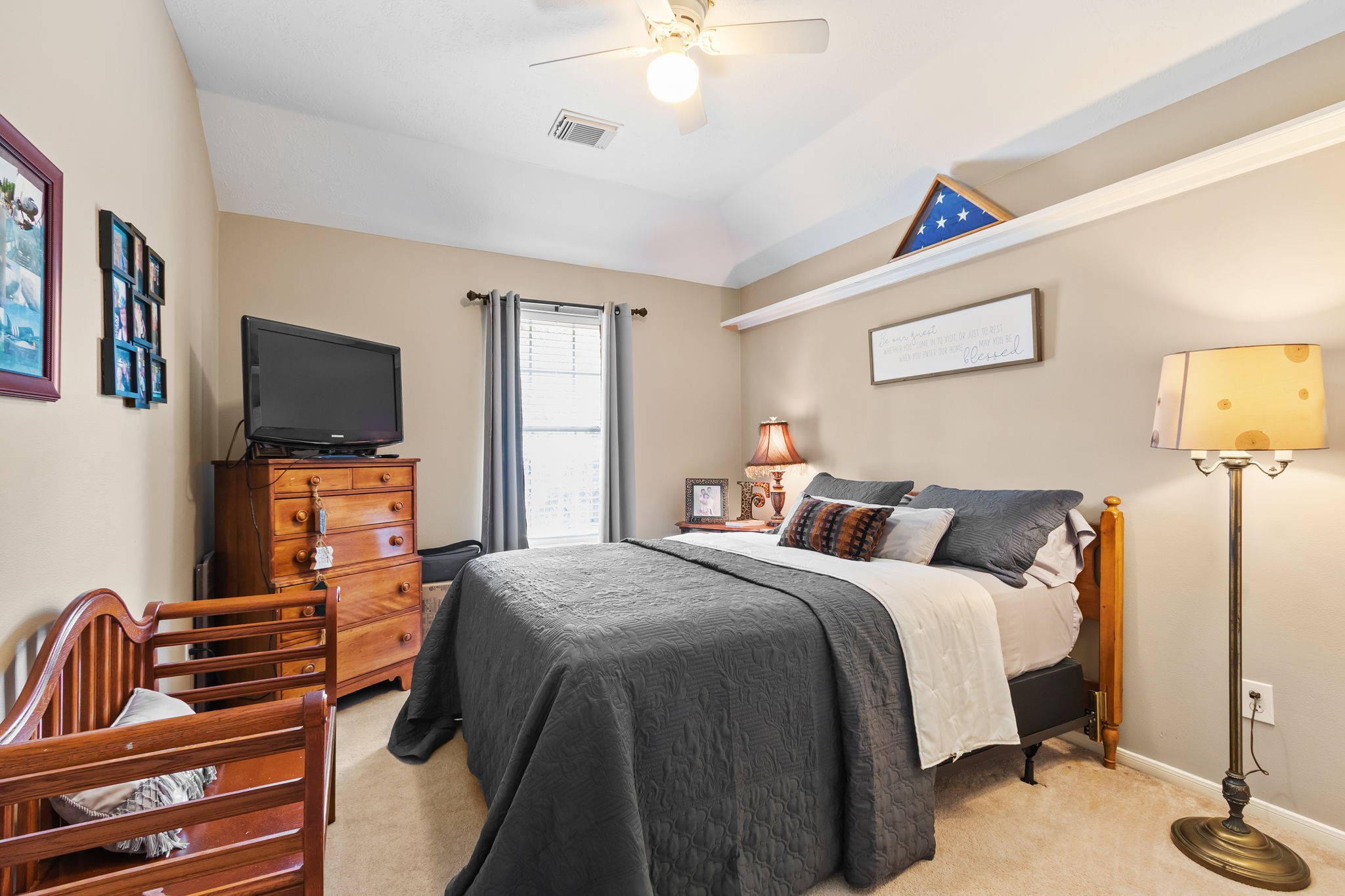 3618 Walnut Forest Lane Spring, TX 77388 - Photo 28 of 43 a bedroom with a bed and a flat screen tv