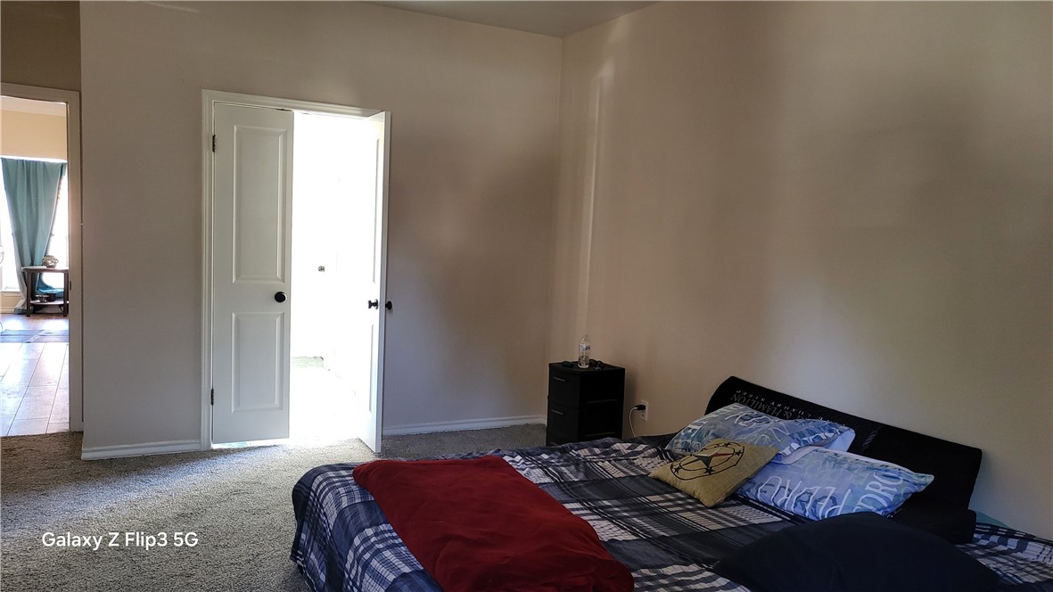 5018 Queen's Court Corpus Christi, TX 78413 - Photo 13 of 26 a bedroom with a bed and a window