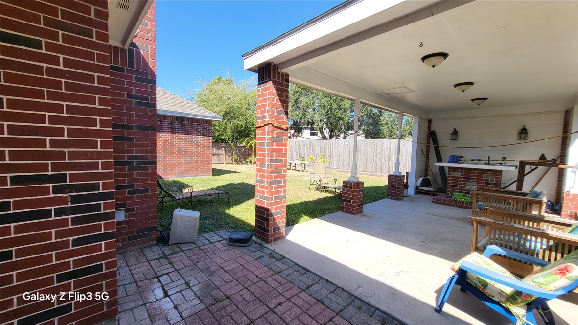 5018 Queen's Court Corpus Christi, TX 78413 - Photo 17 of 26 a view of a porch with chairs and potted plants