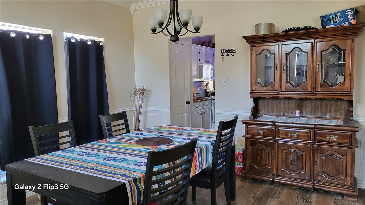 5018 Queen's Court Corpus Christi, TX 78413 - Photo 2 of 26 a kitchen that has a stove and a table in it