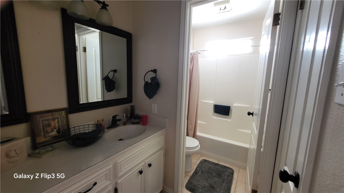5018 Queen's Court Corpus Christi, TX 78413 - Photo 22 of 26 a bathroom with a sink a toilet and shower