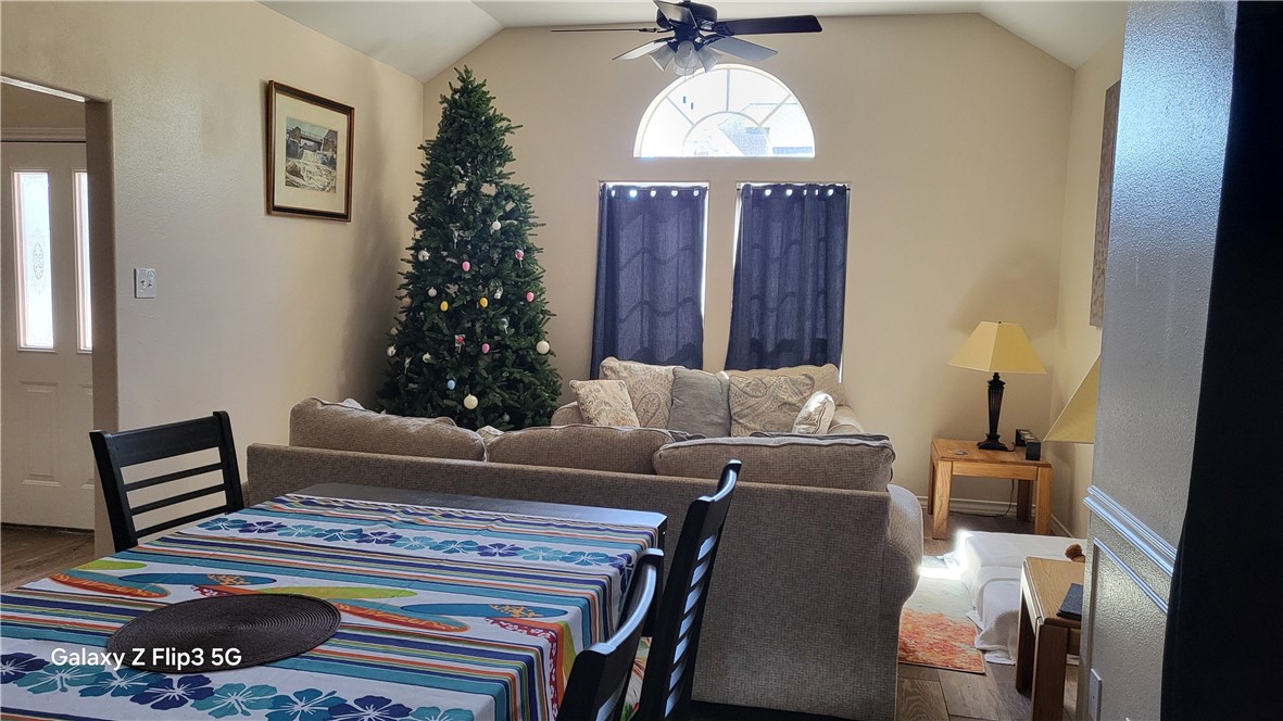 5018 Queen's Court Corpus Christi, TX 78413 - Photo 3 of 26 a living room with furniture and a chandelier