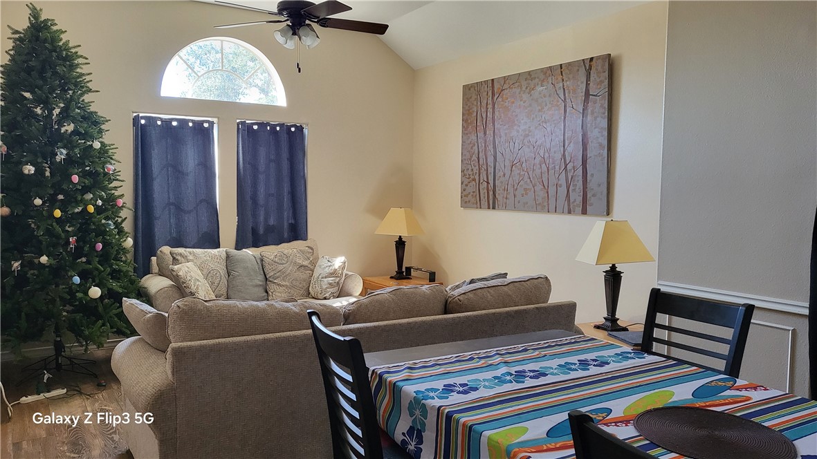 5018 Queen's Court Corpus Christi, TX 78413 - Photo 4 of 26 a living room with furniture and a chandelier