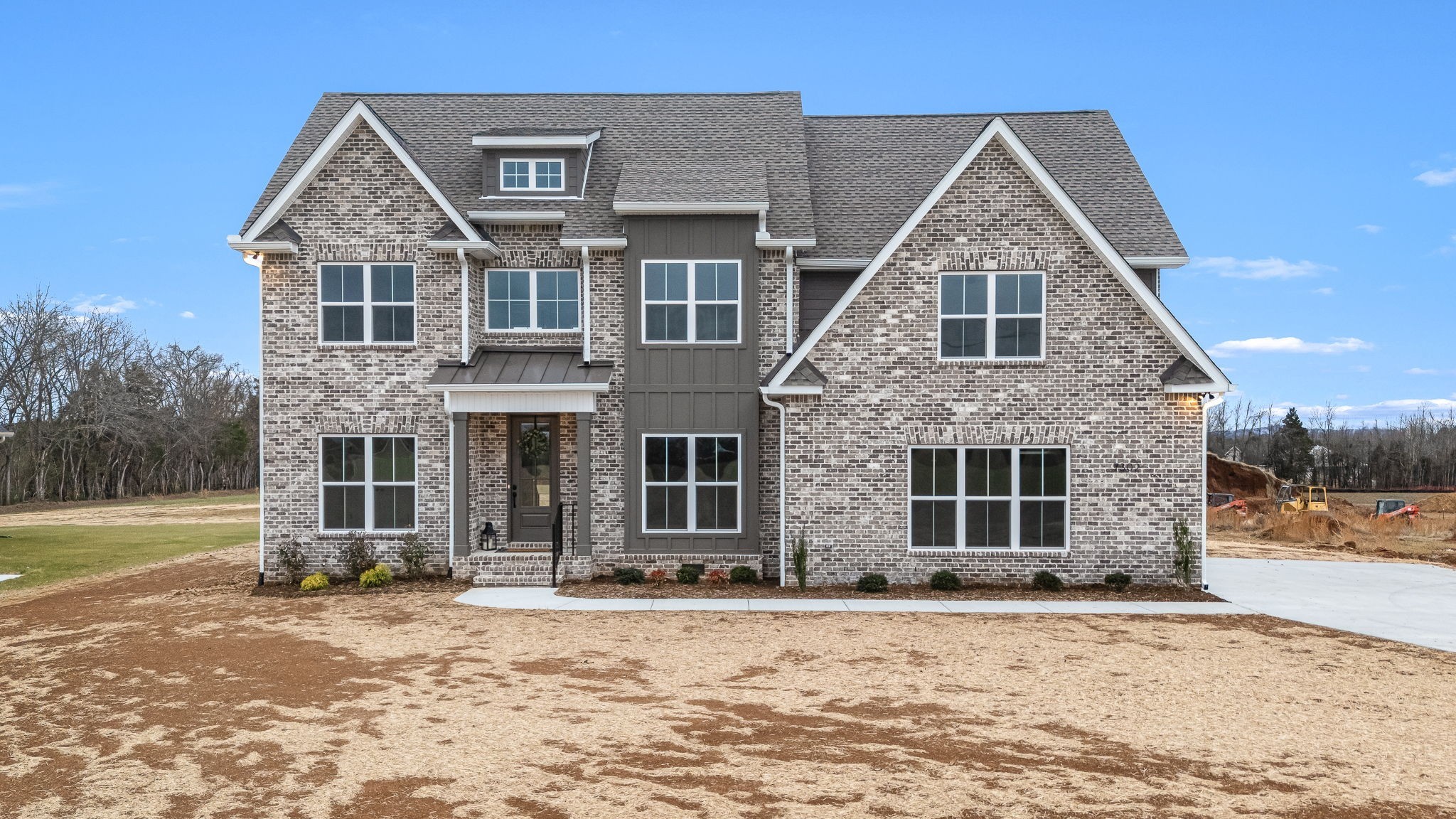 7302 West Gum Road Murfreesboro, TN 37127 - Photo 1 of 53 a front view of a house with a yard