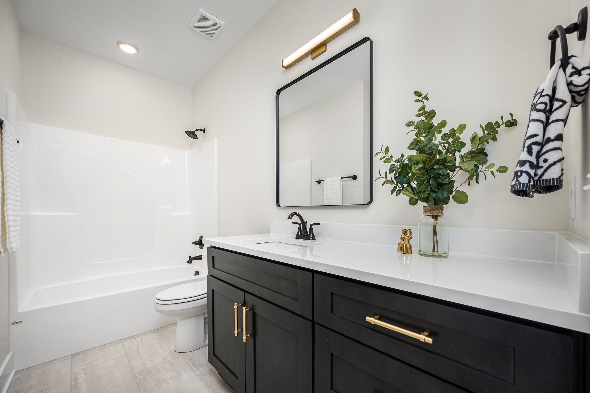 7302 West Gum Road Murfreesboro, TN 37127 - Photo 11 of 53 a bathroom with a sink a toilet and vanity