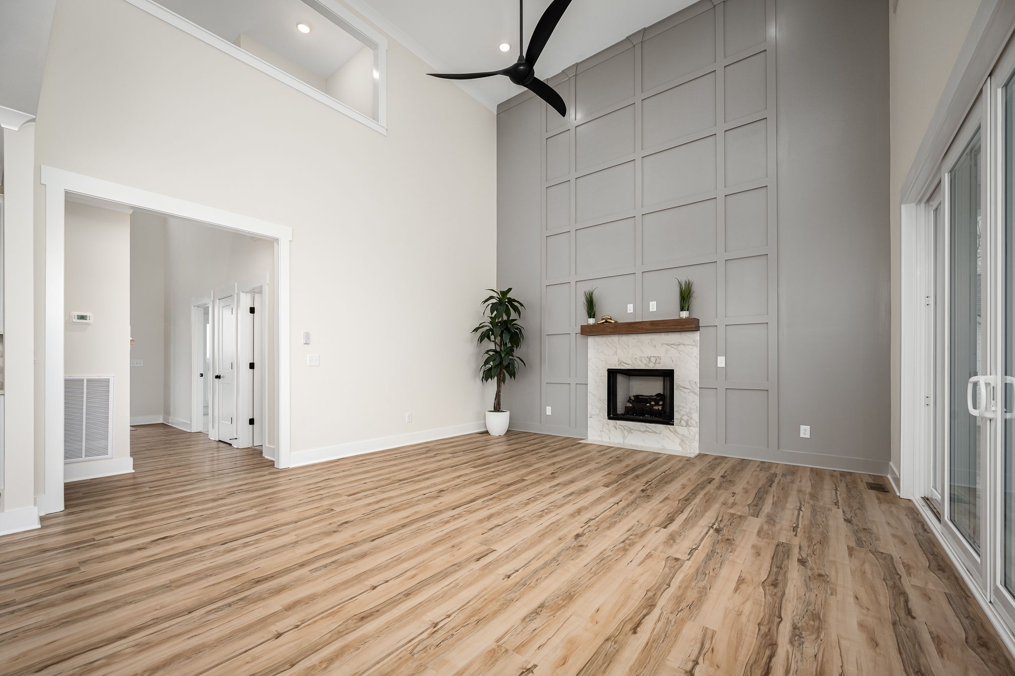 7302 West Gum Road Murfreesboro, TN 37127 - Photo 14 of 53 a view of a livingroom with wooden floor and a fireplace