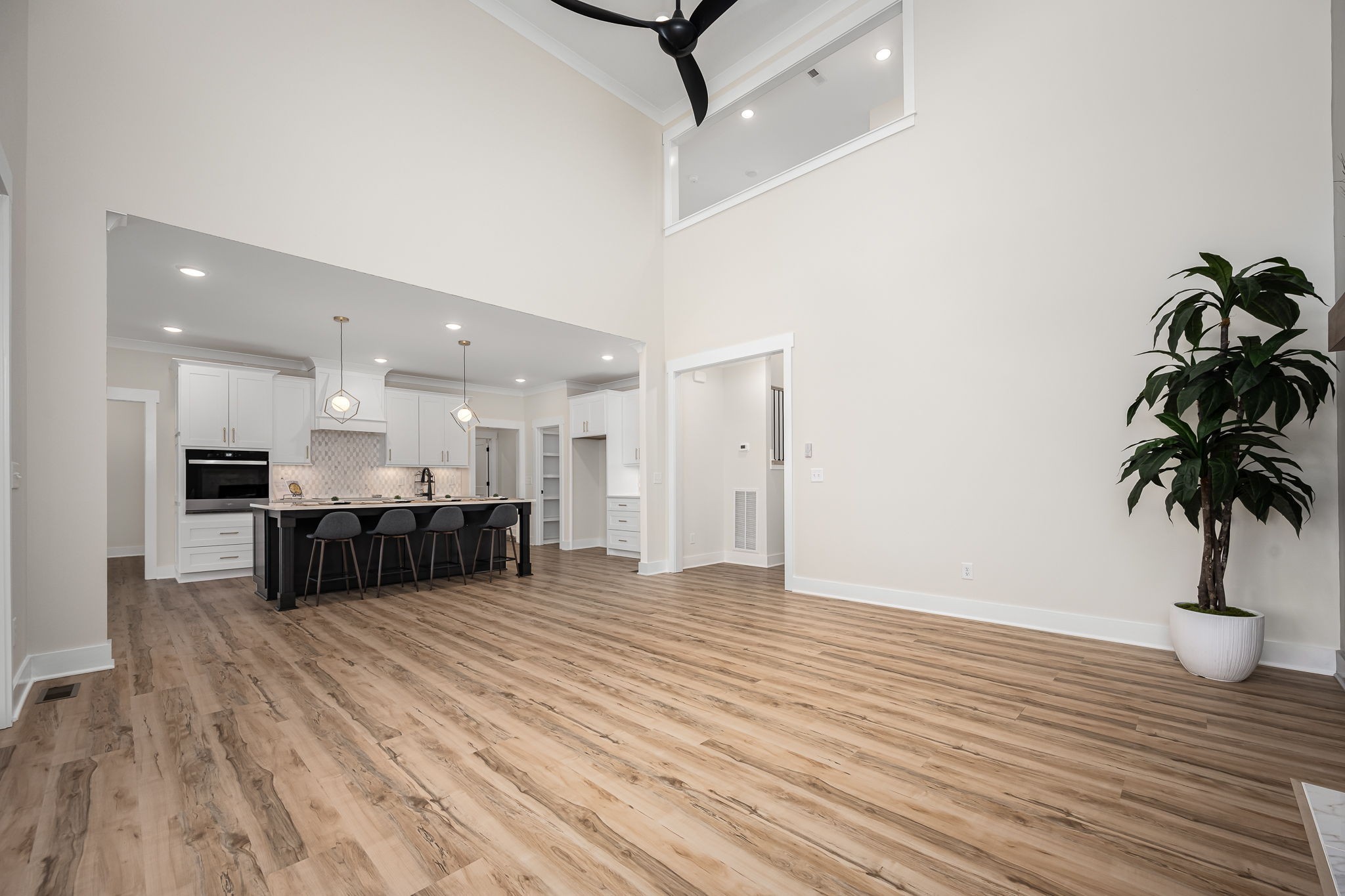 7302 West Gum Road Murfreesboro, TN 37127 - Photo 15 of 53 a living room with furniture kitchen view and a potted plant