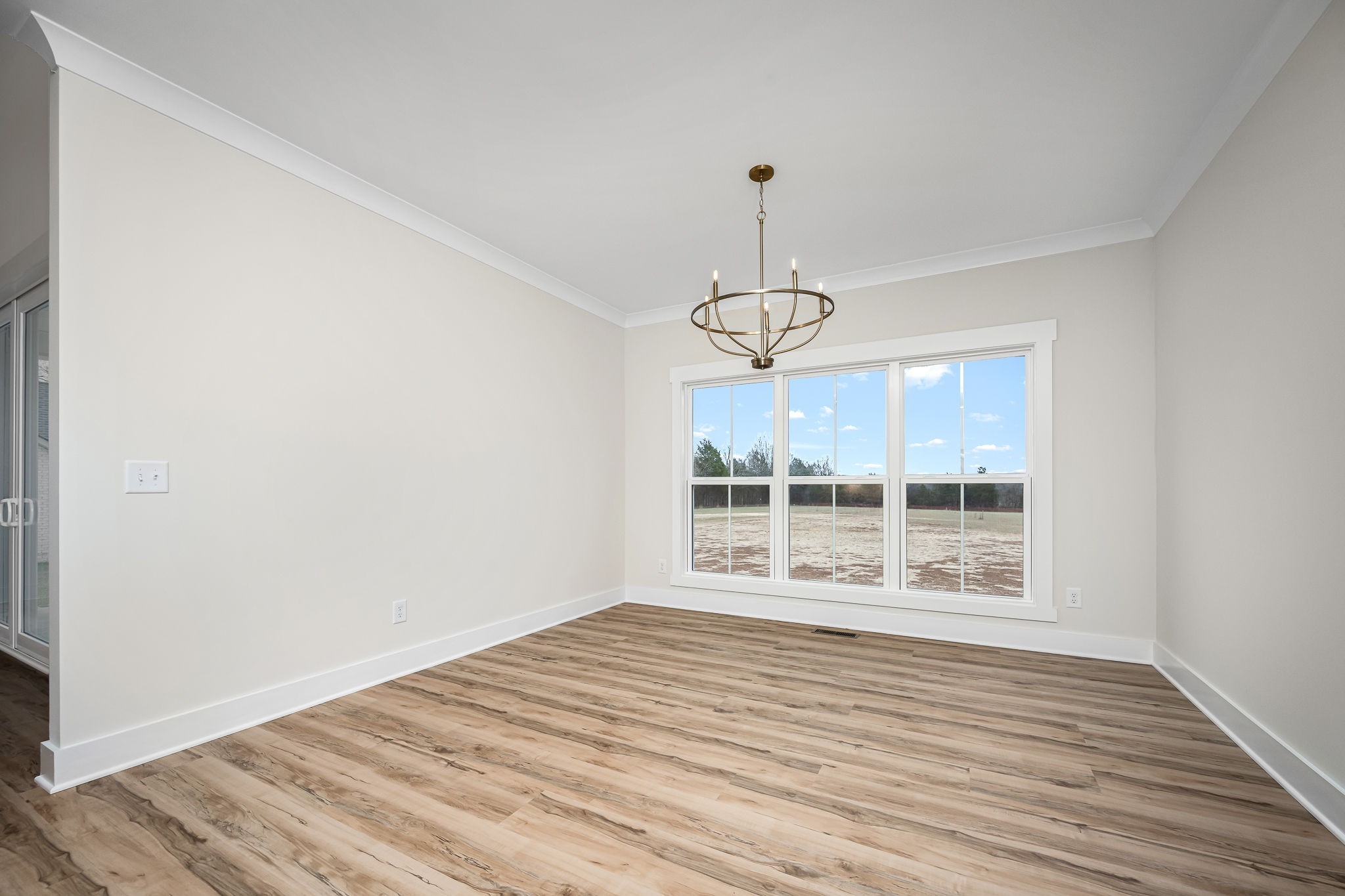 7302 West Gum Road Murfreesboro, TN 37127 - Photo 25 of 53 a view of an empty room with wooden floor and a window